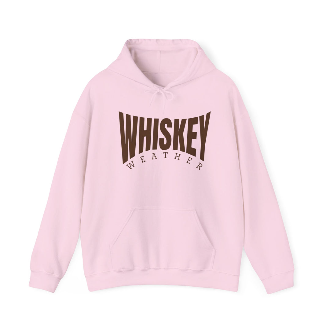 Light-pink pullover hoodie with WHISKEY WEATHER in brown on chest, featuring a kangaroo pocket and drawstring hood. Perfect for cold days.