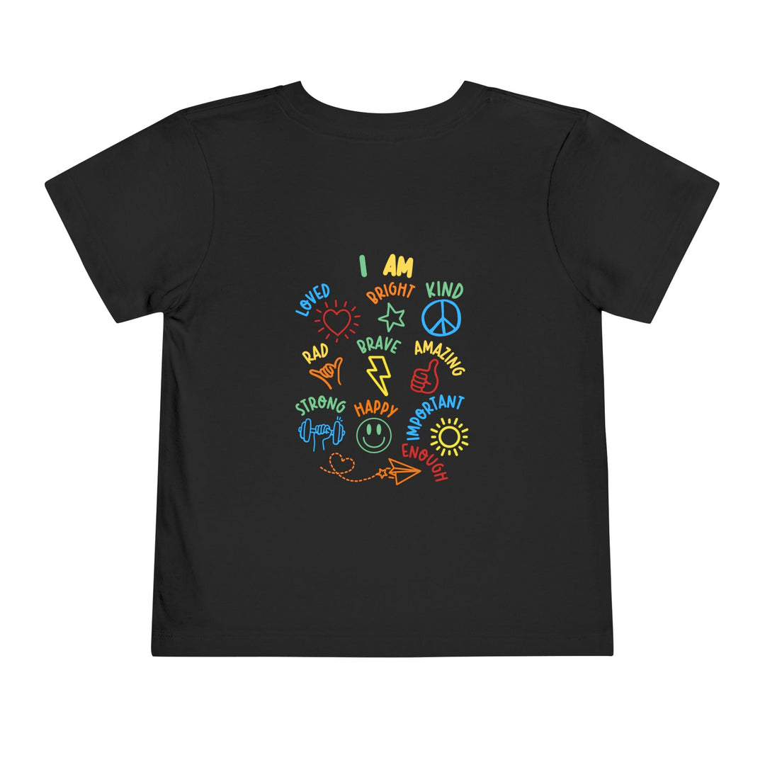 Black toddler T-shirt with colorful, hand-drawn icons and affirming words beneath I AM, promoting positivity and self-affirmation for kids.