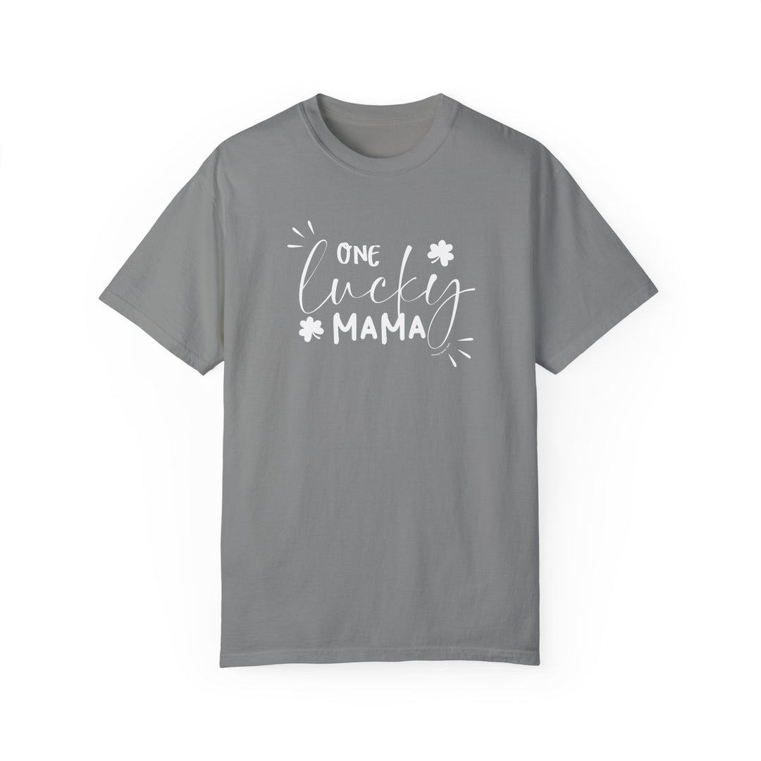 A relaxed fit One Lucky Mama Tee, a grey t-shirt with white text. 100% ring-spun cotton, soft-washed, and garment-dyed for coziness. Durable double-needle stitching, no side-seams for a tubular shape.