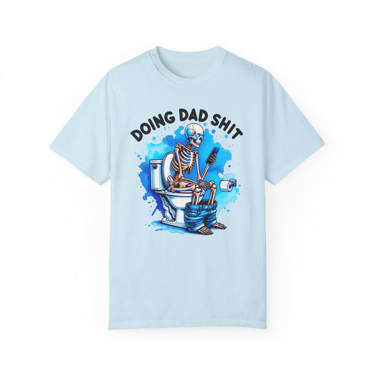 A relaxed fit, garment-dyed t-shirt featuring a skeleton design, ideal for daily wear. Made of 100% ring-spun cotton for coziness and durability. From Worlds Worst Tees, the Doing Dad Shit Tee.