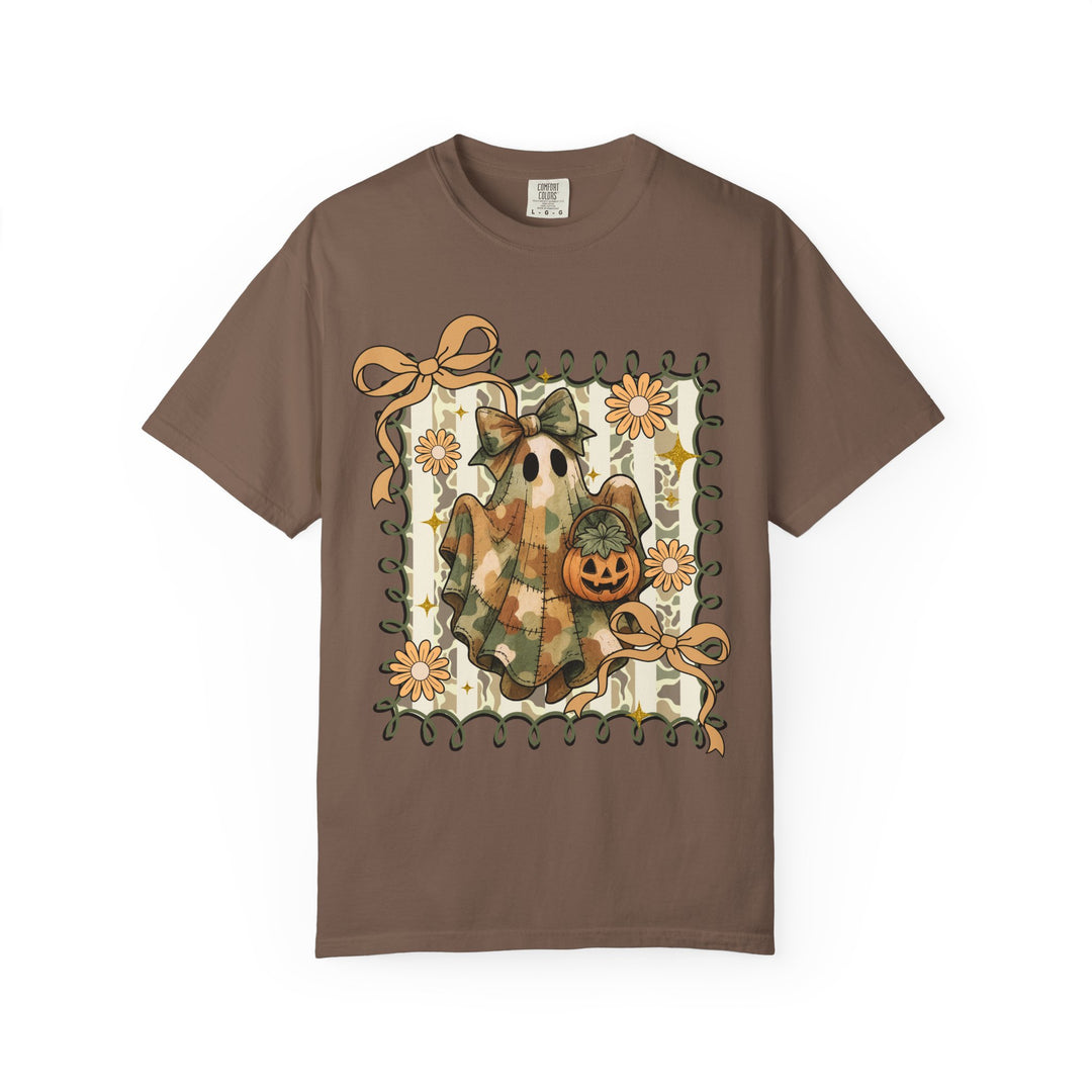 Quilted Ghost Tee featuring a camouflage-patterned ghost with a jack-o’-lantern, framed by vine border, accented with bows and flowers on a brown T-shirt.