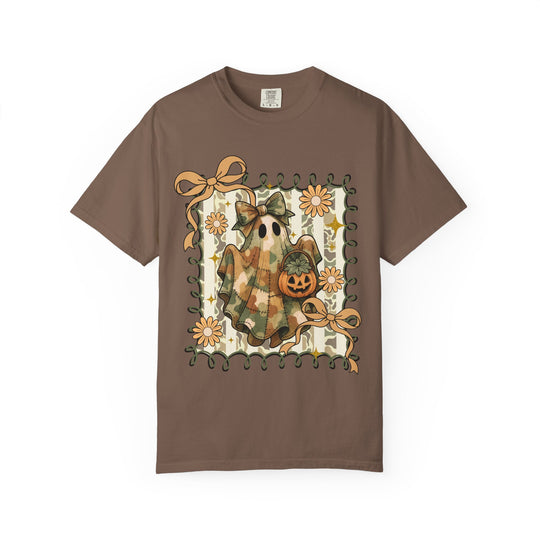 Quilted Ghost Tee featuring a camouflage-patterned ghost with a jack-o’-lantern, framed by vine border, accented with bows and flowers on a brown T-shirt.