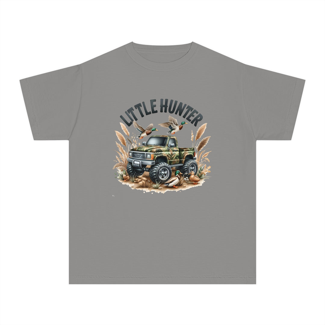 Little Hunter Kids Tee: A camo-patterned shirt featuring a truck and ducks, perfect for active kids. 100% cotton, soft-washed, and garment-dyed for comfort and durability. Ideal for playtime or study sessions.