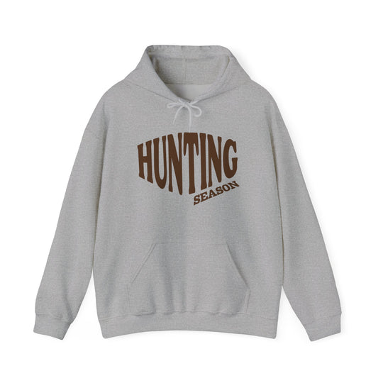 Light-gray Hunting Season hoodie with kangaroo pocket and drawstring hood, offering comfort and style for cold days, featuring bold chest lettering.