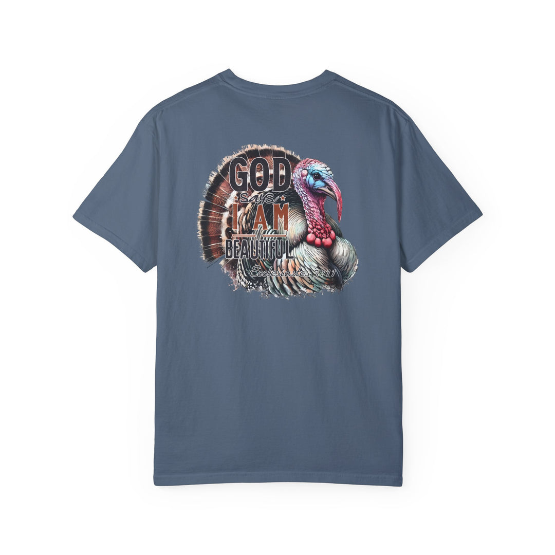 Relaxed fit I am Beautiful Tee, blue shirt with turkey graphic. 100% ring-spun cotton, garment-dyed for coziness. Durable double-needle stitching, no side-seams for tubular shape. Sizes S-3XL.