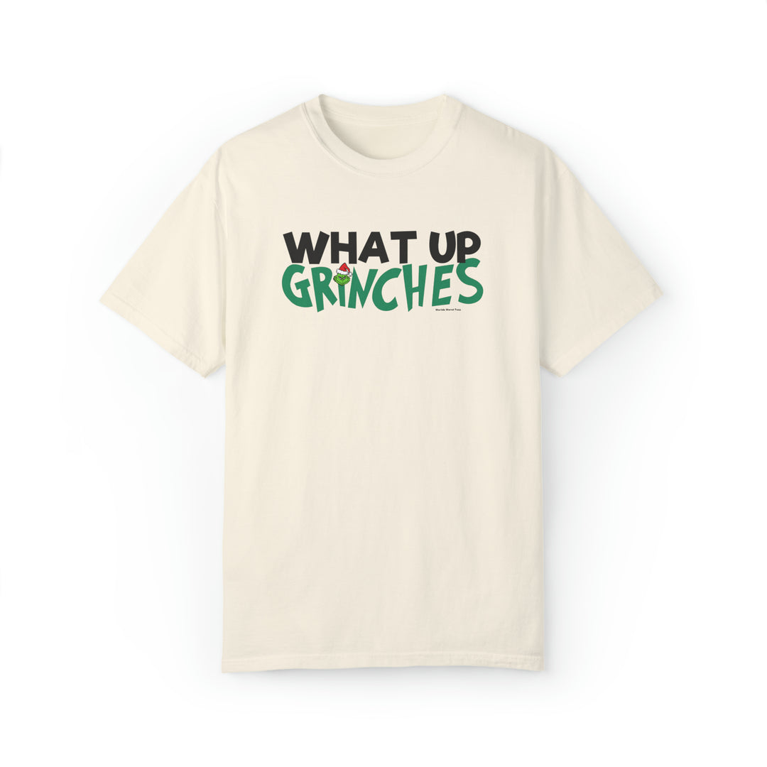Unisex white t-shirt with green and black 'What up Grinches' text. Made of 80% ring-spun cotton and 20% polyester. Relaxed fit, rolled-forward shoulder, and back neck patch. From Worlds Worst Tees.