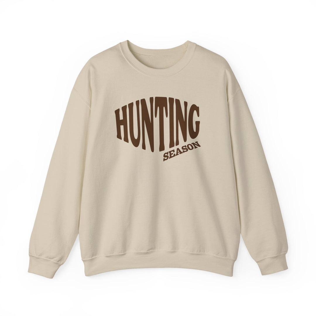 Cream crewneck sweatshirt with “HUNTING SEASON” in brown block font, combining comfort and style with durable, ethically-sourced materials. Perfect for cooler weather.