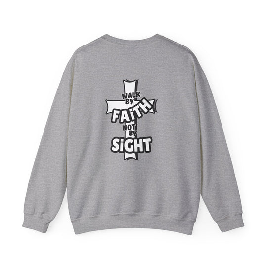 A grey sweatshirt with a cross and text, ideal for comfort in any situation. Unisex heavy blend crewneck featuring ribbed knit collar, no itchy side seams, and a loose fit. Walk By Faith Not By Sight Crew.