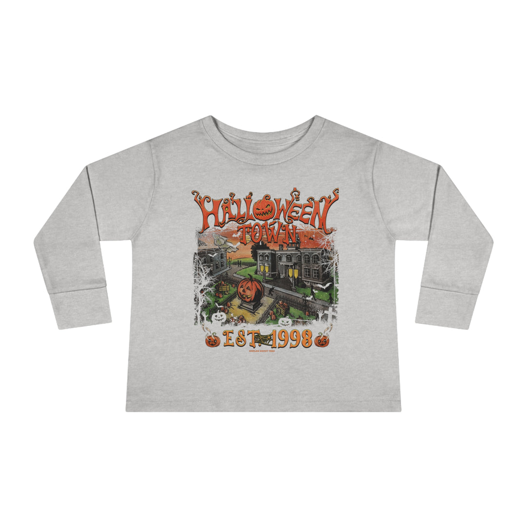 Halloweentown Toddler Long Sleeve Tee featuring a graphic design of a house and pumpkins. Made of 100% cotton, with ribbed collar and EasyTear™ label for comfort and durability. From Worlds Worst Tees.