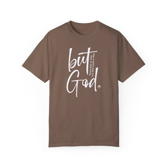 A relaxed fit But God Tee, brown t-shirt with white text. 100% ring-spun cotton, garment-dyed for coziness. Durable double-needle stitching, no side-seams for a tubular shape. Ideal for daily wear.