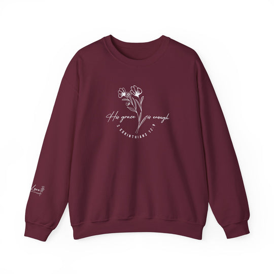 A maroon His Grace Is Enough Crew sweatshirt with white text, featuring a ribbed knit collar and double-needle stitching for durability. Made from a cozy 50% cotton and 50% polyester blend.