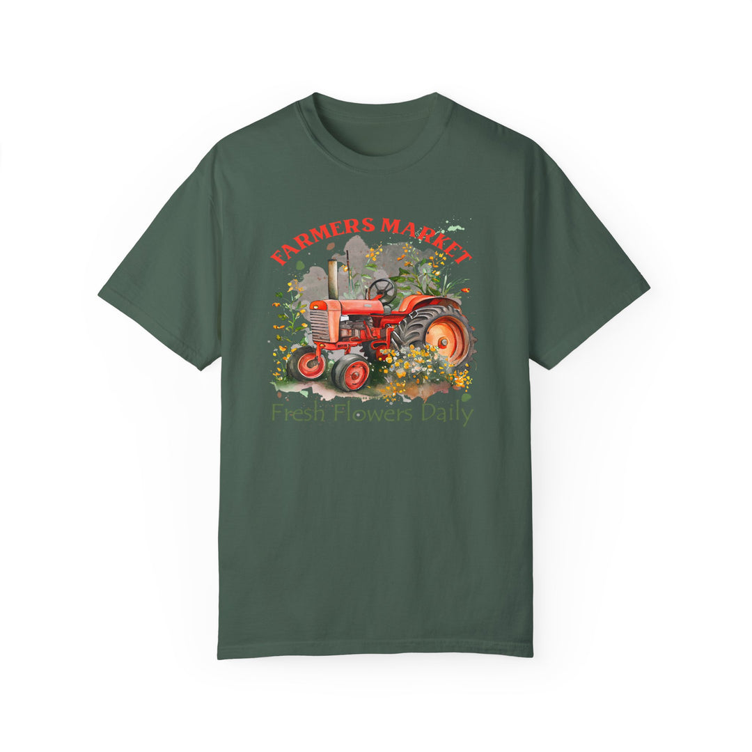 A green t-shirt featuring a tractor design, part of the Fresh Flowers Tee collection at Worlds Worst Tees. Made of 100% ring-spun cotton for a cozy feel, with double-needle stitching for durability and a relaxed fit for everyday comfort.