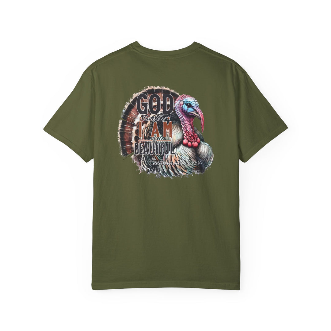 A green shirt featuring a turkey design, the I am Beautiful Tee by Worlds Worst Tees. Made of 100% ring-spun cotton, garment-dyed for softness, with a relaxed fit and durable double-needle stitching.