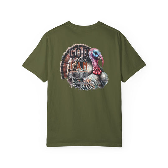 A green shirt featuring a turkey design, the I am Beautiful Tee by Worlds Worst Tees. Made of 100% ring-spun cotton, garment-dyed for softness, with a relaxed fit and durable double-needle stitching.