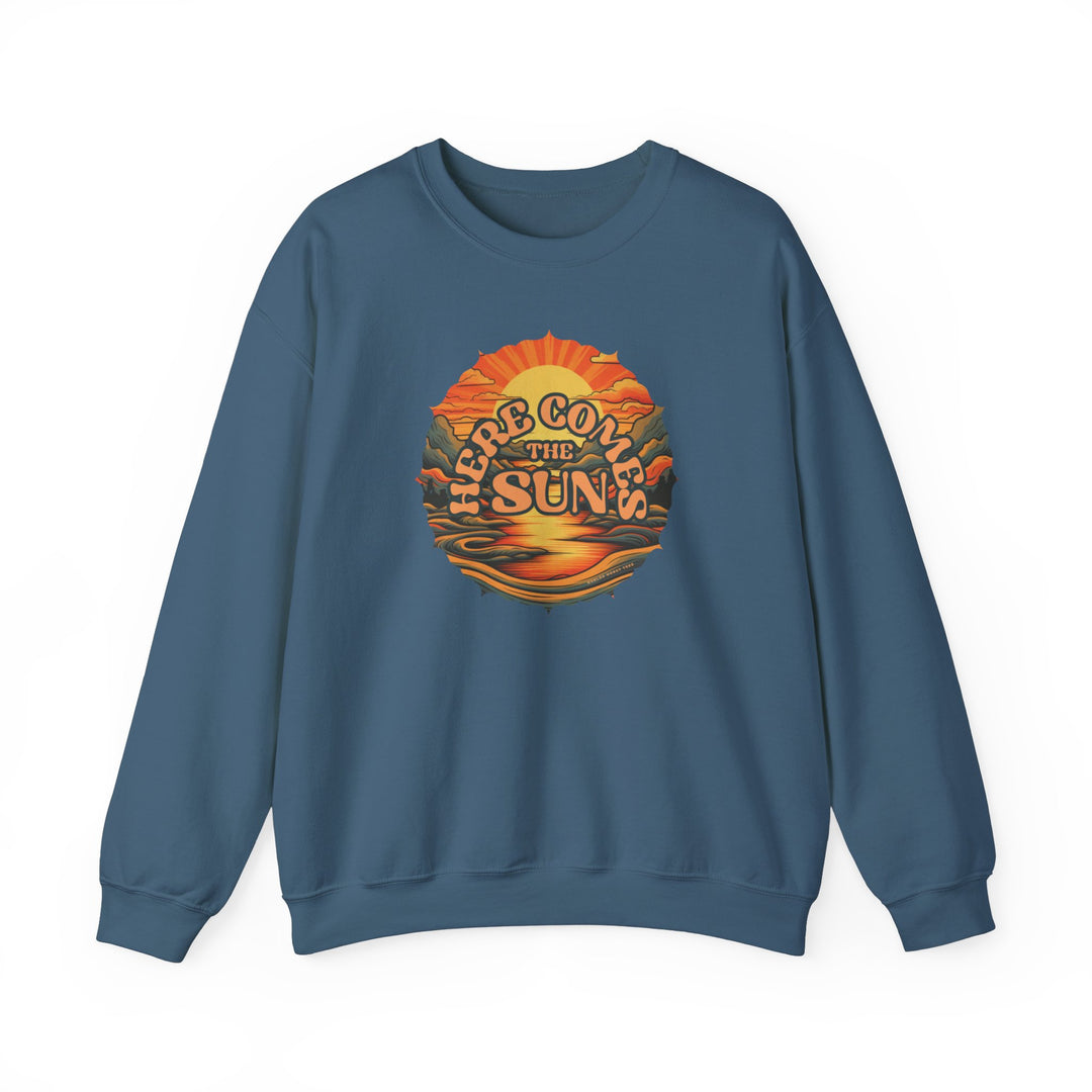 Unisex heavy blend crewneck sweatshirt featuring a graphic design of a sunset and mountains, named Here Comes the Sun Crew. Ribbed knit collar, no itchy side seams, 50% Cotton 50% Polyester, medium-heavy fabric.