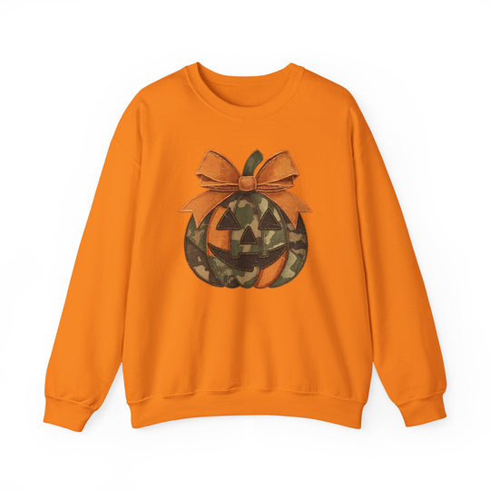 Jackie O Crew: Orange sweatshirt with camo-patterned jack-o-lantern graphic topped with an orange bow, ideal for cozy, playful Halloween style.