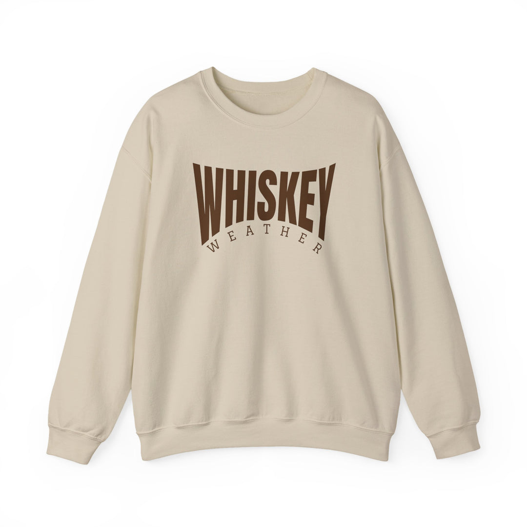 Cream-colored crewneck sweatshirt with WHISKEY boldly arched and WEATHER beneath in brown, ideal for cozy, stylish wear.