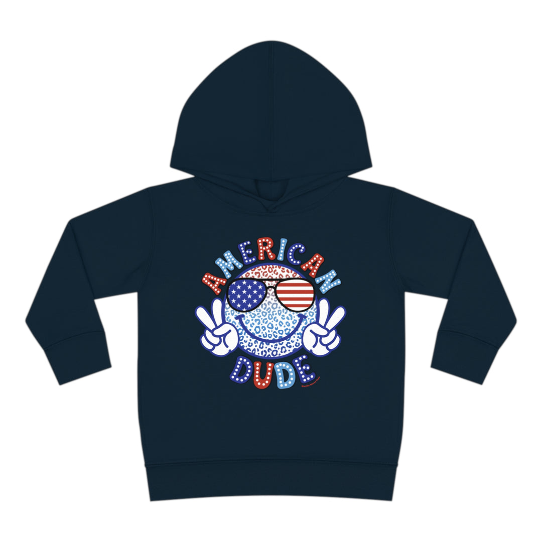 American Dude Toddler Hoodie featuring a smiley face with sunglasses design. Jersey-lined hood, cover-stitched details, and side seam pockets for durability and coziness. Made of 60% cotton, 40% polyester. Sizes: 2T, 4T, 5-6T.