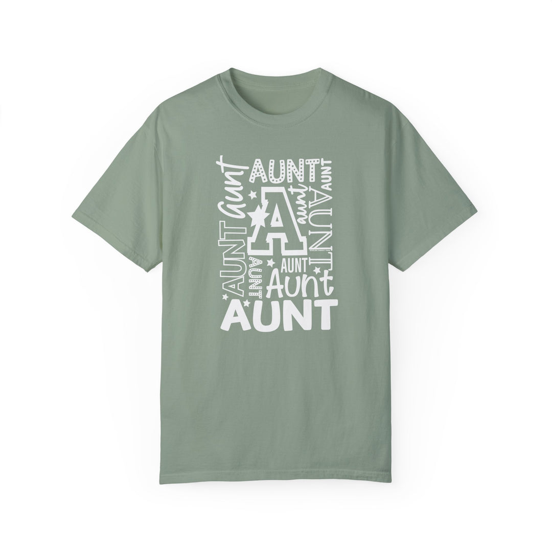 Aunt Tee: Garment-dyed t-shirt in green with white text. 100% ring-spun cotton, medium weight, relaxed fit, durable double-needle stitching, no side-seams for a tubular shape.