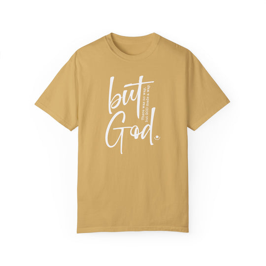 A tan But God Tee, 100% ring-spun cotton, garment-dyed with a relaxed fit. Double-needle stitching for durability, no side-seams for shape retention. Ideal for daily wear.
