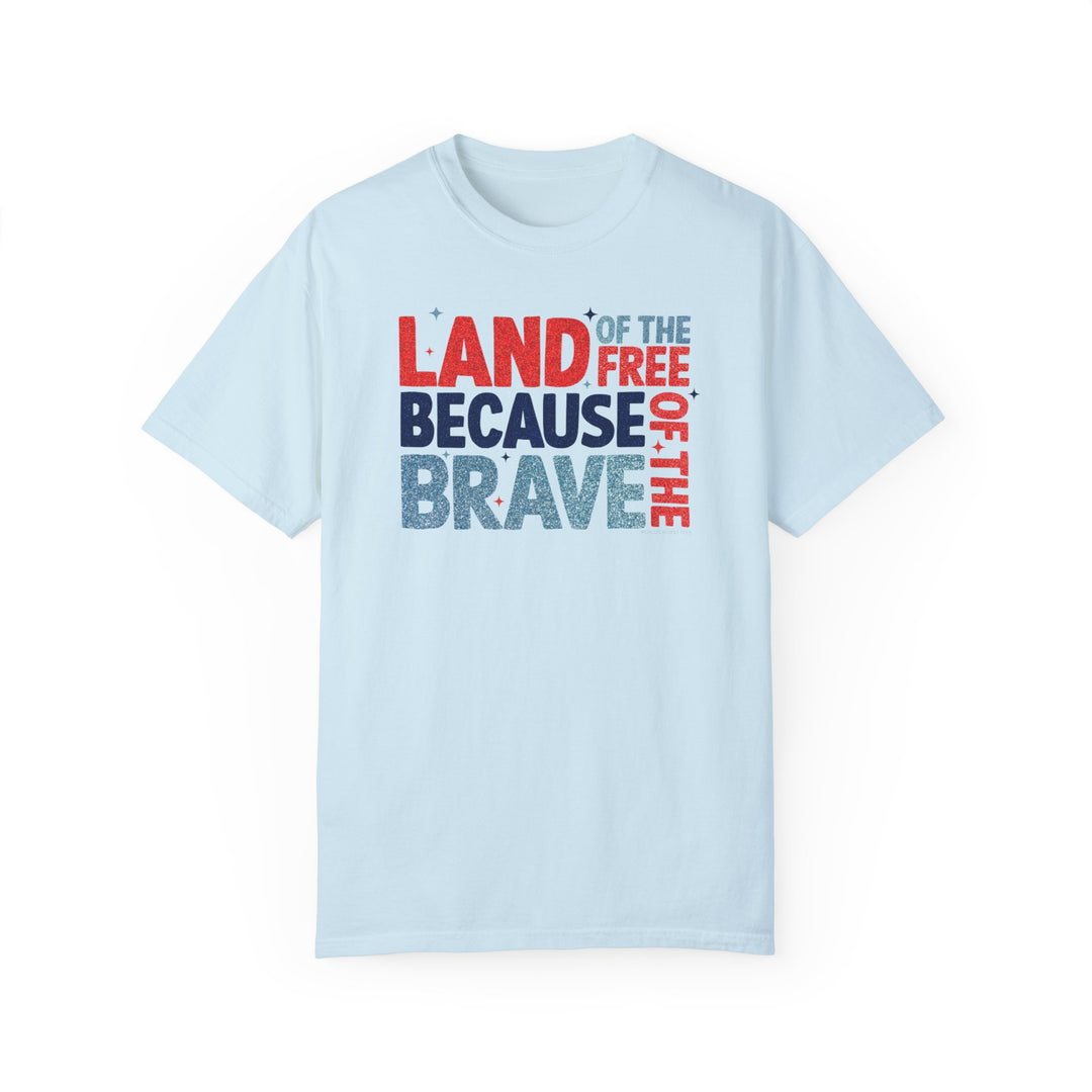 Land of the Free Tee: White t-shirt with red and blue text. 100% ring-spun cotton, garment-dyed for coziness. Relaxed fit, double-needle stitching, no side-seams for durability and shape retention.