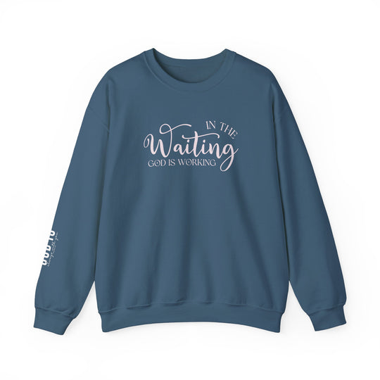 A blue sweatshirt with white text, the God is Working Crew, a comfortable unisex heavy blend crewneck. Made of 50% cotton, 50% polyester, ribbed knit collar, no itchy side seams. Medium-heavy fabric, loose fit.