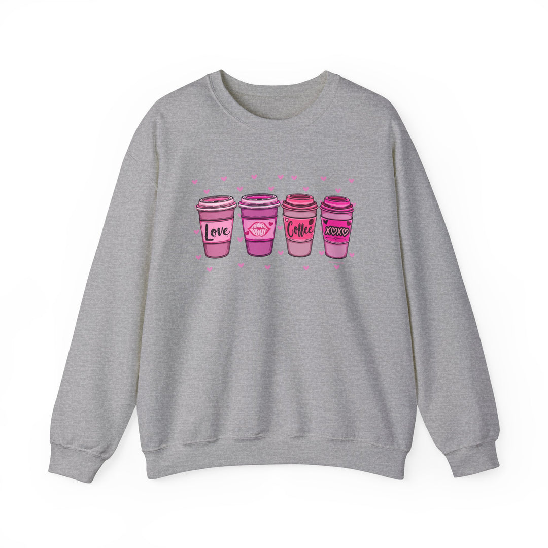 Unisex XOXO Coffee Crew sweatshirt, grey with pink coffee cups. Heavy blend fabric, ribbed knit collar, no itchy seams. Sizes S-5XL. Ideal comfort for any occasion.