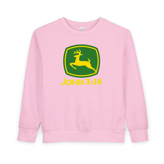 Light-pink toddler crewneck sweatshirt with a spoof John Deere logo, featuring a yellow deer and John 3:16 text, offering warmth and comfort.