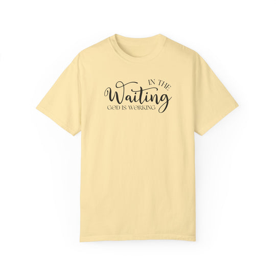 A relaxed fit God is Working Tee, crafted from 100% ring-spun cotton. Garment-dyed for coziness, featuring double-needle stitching for durability and a seamless design for a tubular shape.