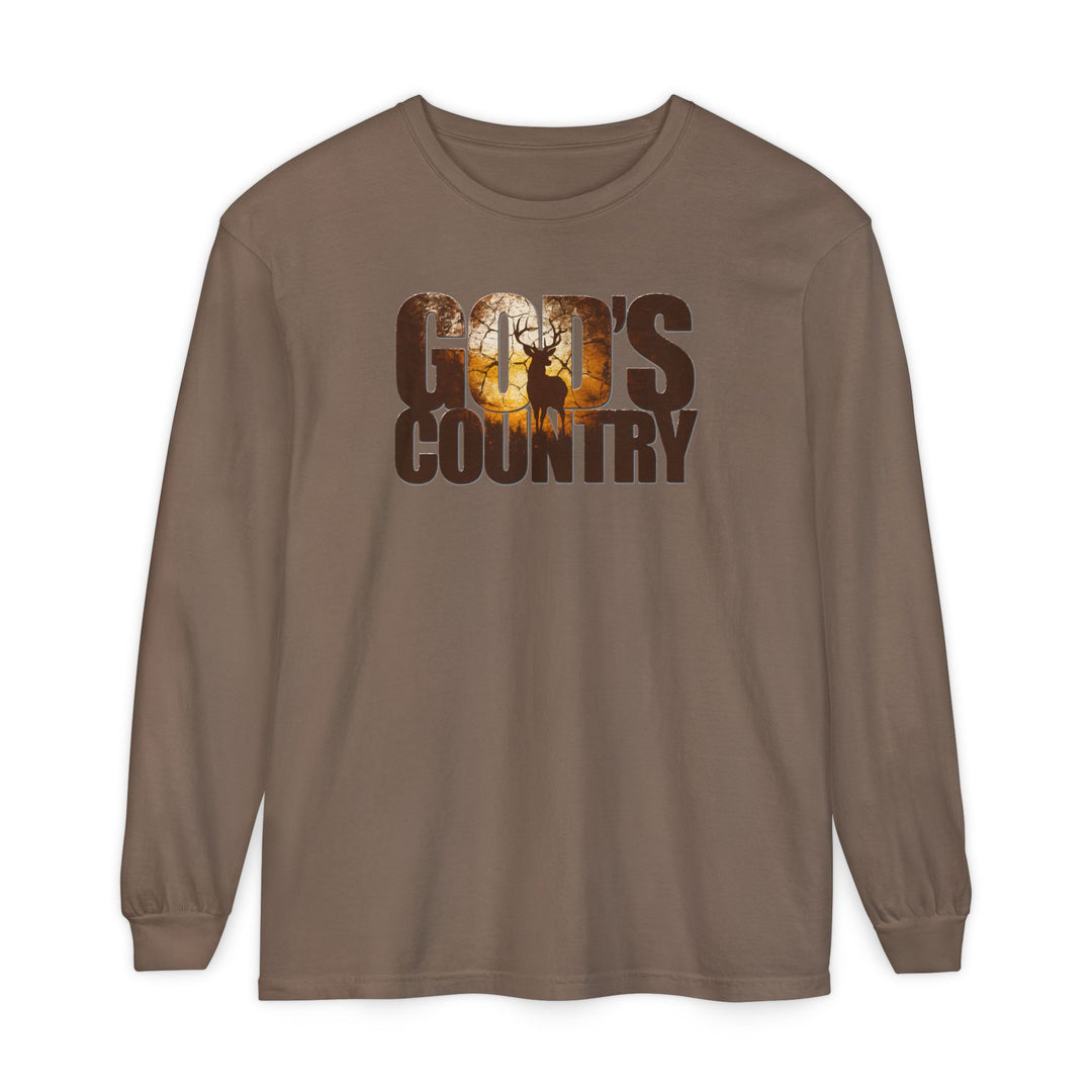 Earth-brown God's Country long-sleeve tee featuring a sunset woodland scene with deer silhouette, crafted from soft ring-spun cotton for a relaxed fit.