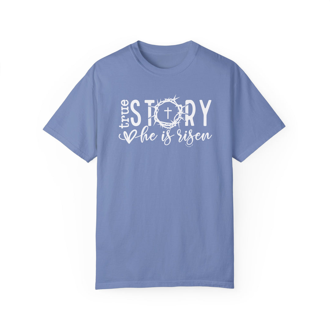 True Story He is Risen Tee: Blue shirt with white cross and crown design. 100% ring-spun cotton, garment-dyed for coziness. Relaxed fit, durable double-needle stitching, no side-seams for tubular shape.