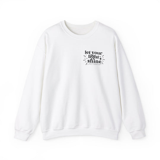 A unisex heavy blend crewneck sweatshirt featuring Let Your Light Shine text. Made of 50% cotton and 50% polyester, ribbed knit collar, no itchy side seams. Medium-heavy fabric, loose fit, true to size.