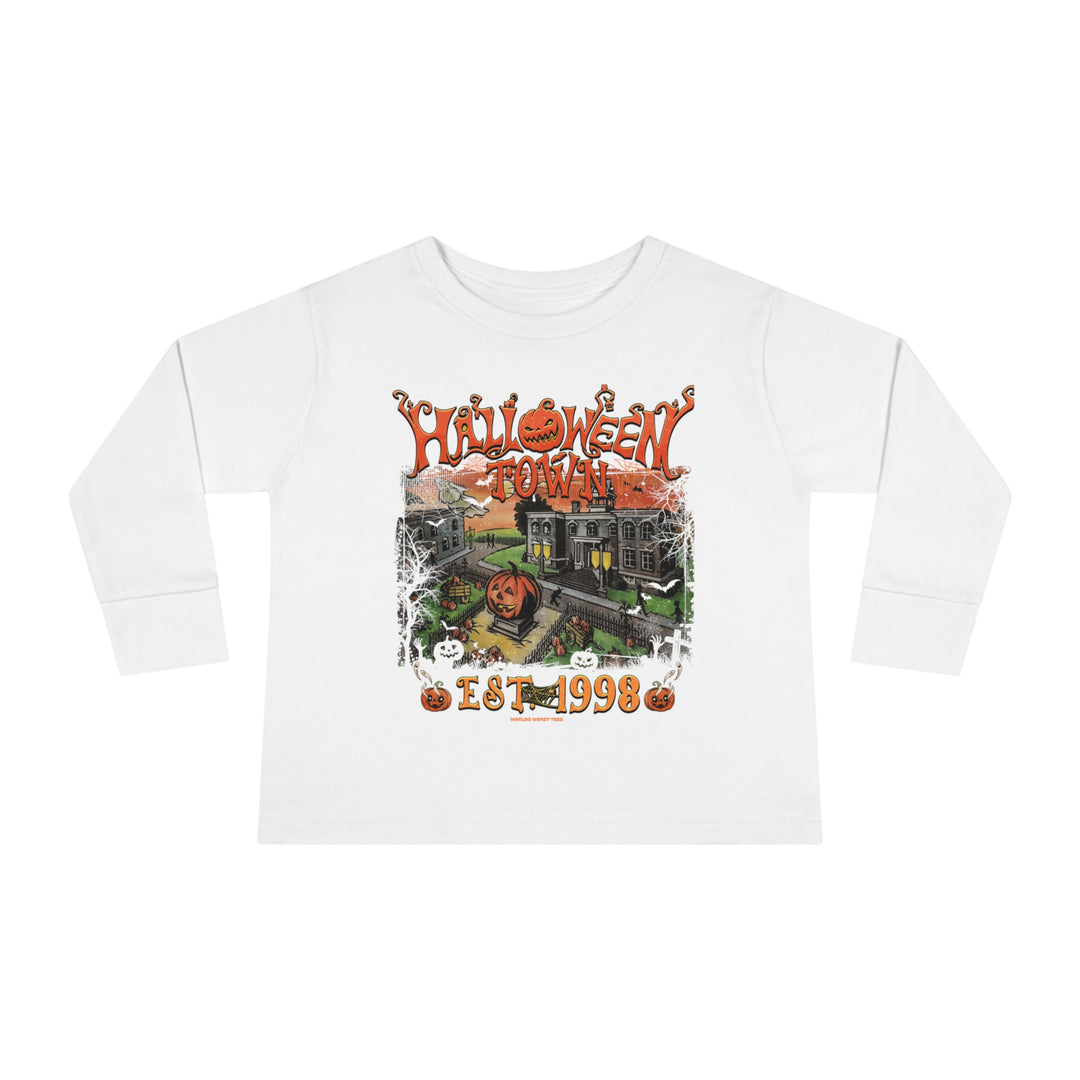 A Halloween-themed toddler long sleeve tee featuring a whimsical pumpkin and house graphic design. Made of durable 100% combed ringspun cotton with ribbed collar and EasyTear™ label for comfort. From 'Worlds Worst Tees'.