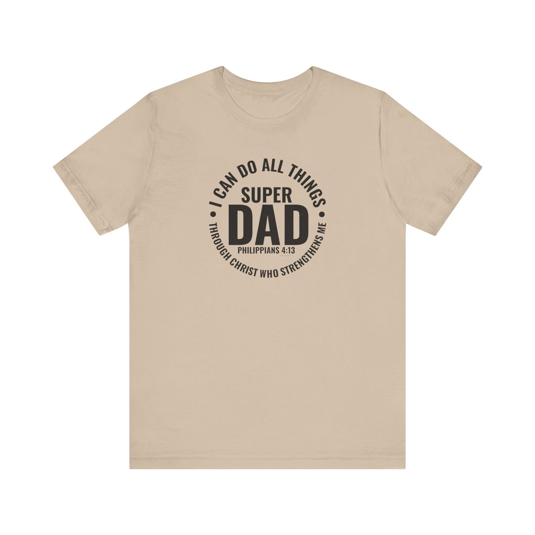 A Super Dad Tee in tan with black text, featuring a classic unisex jersey design. Made of 100% Airlume combed cotton, light fabric, ribbed knit collars, and tear-away label. Sizes XS to 3XL.