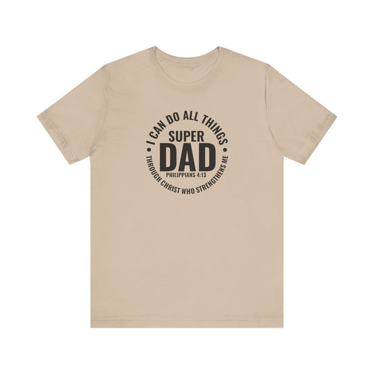 A Super Dad Tee in tan with black text, featuring a classic unisex jersey design. Made of 100% Airlume combed cotton, light fabric, ribbed knit collars, and tear-away label. Sizes XS to 3XL.