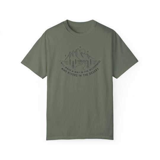 A green t-shirt featuring a mountain and trees graphic design, made of 100% ring-spun cotton for a cozy feel. Relaxed fit, double-needle stitching, and no side-seams for durability and comfort. From 'Worlds Worst Tees'.
