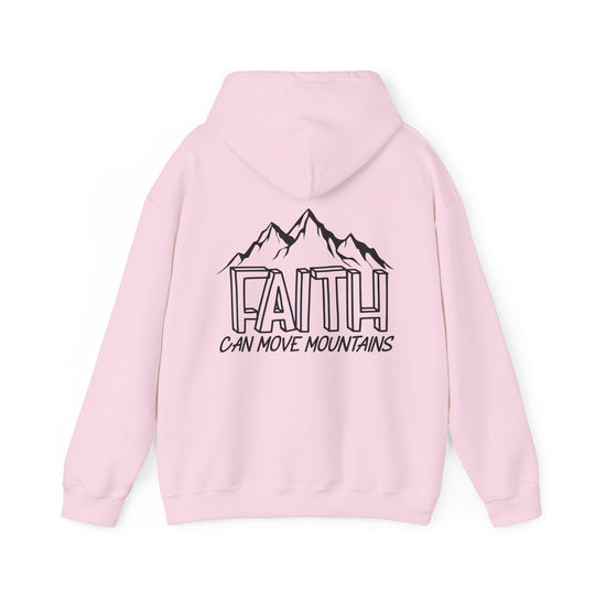 A pink hoodie with a logo, featuring a kangaroo pocket and drawstring hood. Unisex heavy blend for warmth and comfort, ideal for cold days. Faith Can Move Mountains Hoodie by Worlds Worst Tees.