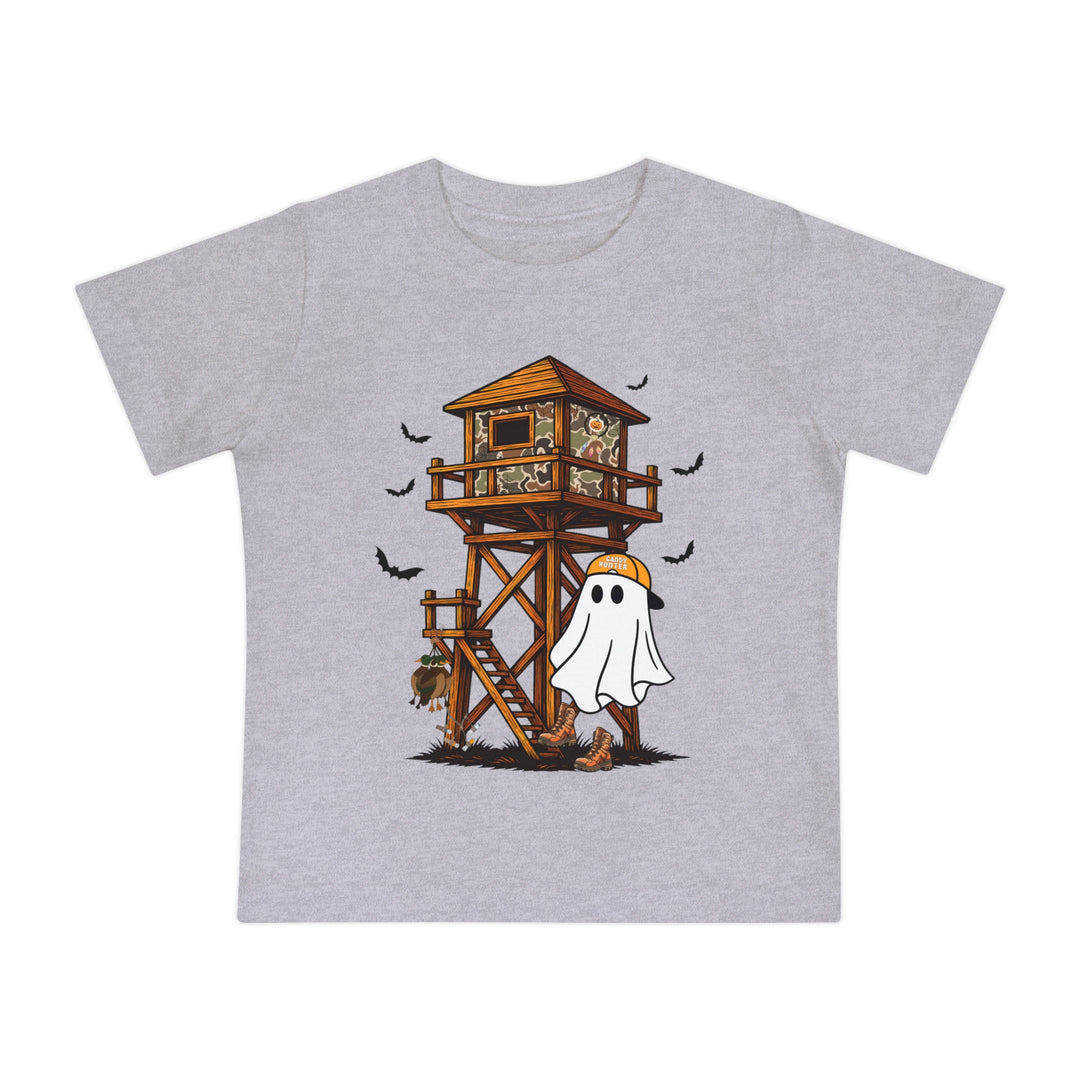 Ghost Hunter Baby Tee features a whimsical hunting-meets-Halloween design with a cartoon ghost in a cap and boots, hunting stand, bats, and fallen leaves.