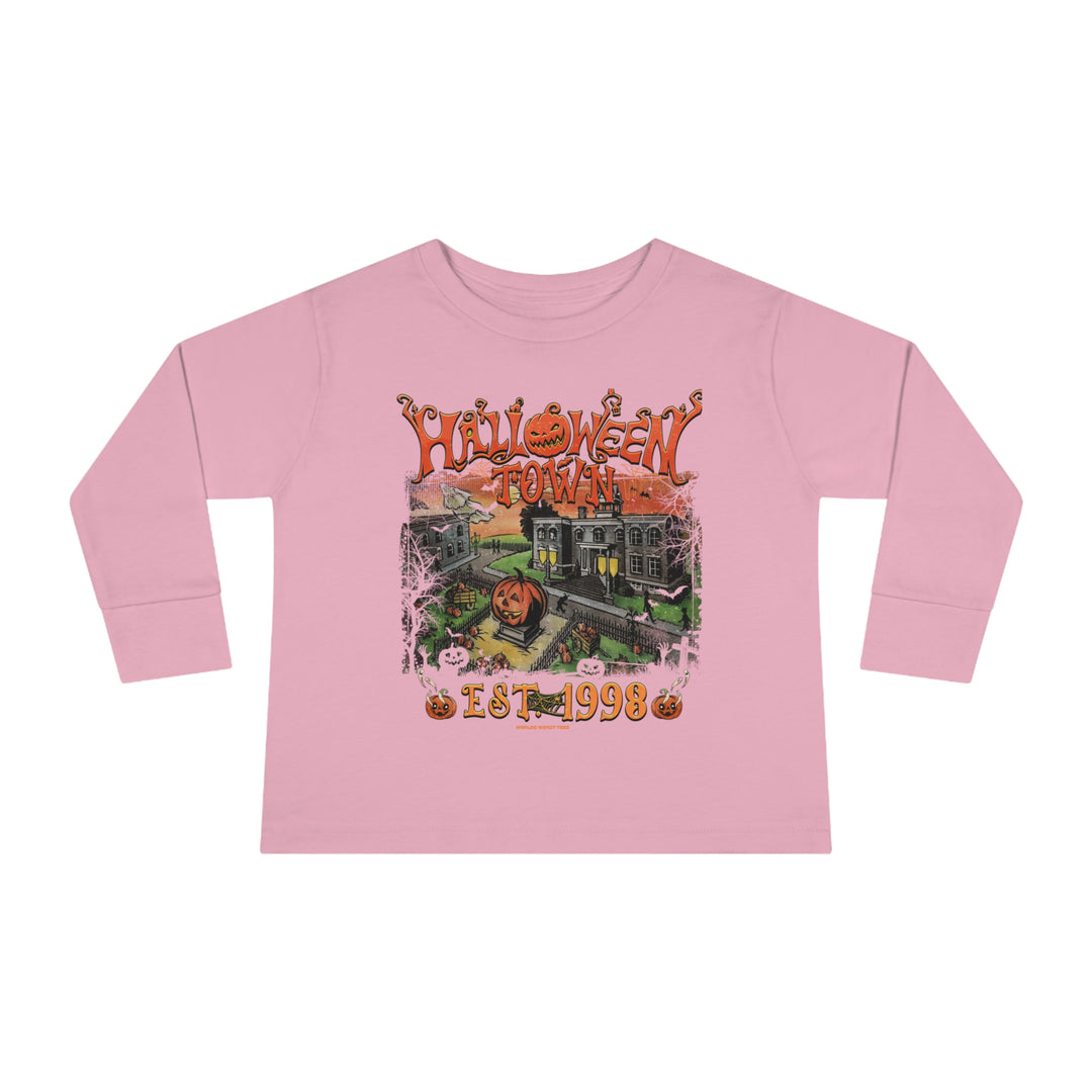 A pink toddler long-sleeve tee featuring a graphic of a house and pumpkins, perfect for the little ones. Made of 100% combed ringspun cotton, with topstitched ribbed collar and EasyTear™ label for comfort and durability.