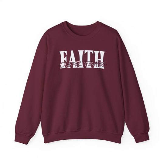 A maroon crewneck sweatshirt with white Faith Over Fear text, ideal for comfort in a heavy blend of cotton and polyester. Ribbed knit collar, no itchy side seams, loose fit, and true to size.