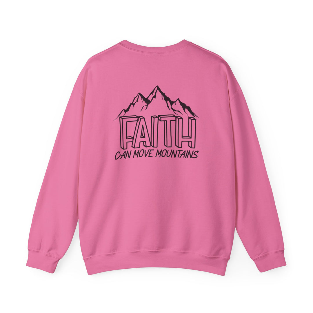 Unisex Faith Can Move Mountains Crew sweatshirt, featuring a pink mountain print and text. Heavy blend fabric for comfort, ribbed collar, and durable stitching. Ideal for colder months, with a classic fit and tear-away label. Made ethically in the US.