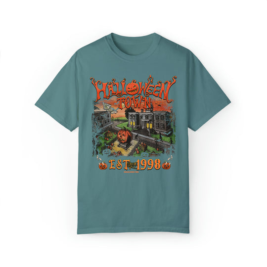Alt text: Halloweentown Tee featuring a train and pumpkin graphic on a blue shirt. Unisex garment-dyed sweatshirt with 80% ring-spun cotton, 20% polyester, relaxed fit, and rolled-forward shoulder.
