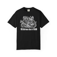 For Everything There is a Season Tee features a wildlife graphic with a buck, fox, ducks, and fish, highlighting nature's cycle, on a black T-shirt.