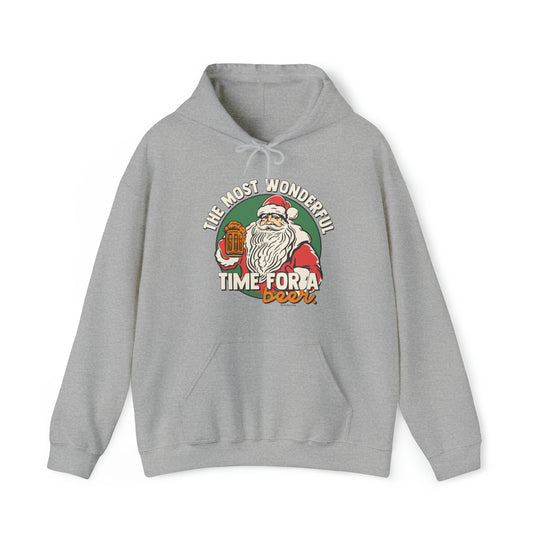A grey sweatshirt featuring a Santa Claus design, perfect for the holiday season. Unisex heavy blend hooded sweatshirt made of 50% cotton and 50% polyester, with a kangaroo pocket and drawstring hood. Classic fit, medium-heavy fabric.