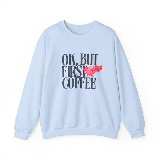 Unisex heavy blend crewneck sweatshirt titled Ok But First Coffee, featuring durable stitching and a ribbed collar, ideal for cozy, stylish comfort.