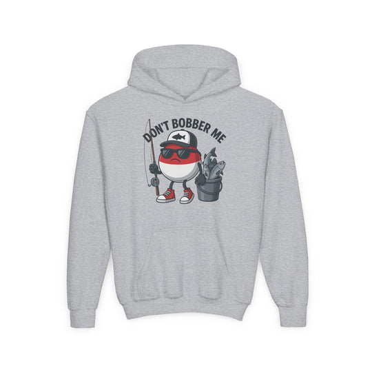 Don't Bobber Me Youth Hoodie featuring a fun graphic of a fishing bobber character with sunglasses and fishing gear. Ultra-soft, preshrunk fleece with kangaroo pocket.