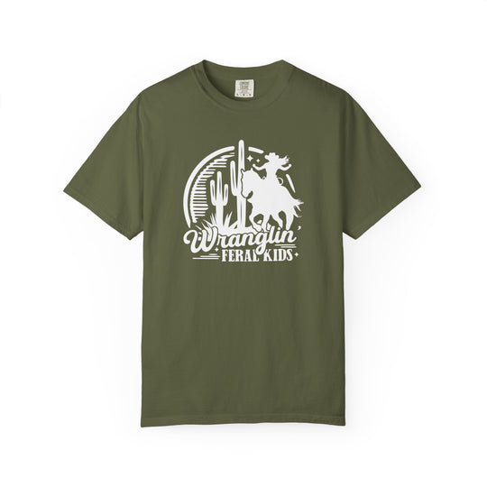 Olive-green Wranglin’ Feral Kids tee featuring a cowboy graphic and desert scene, offering a relaxed fit and durable, garment-dyed cotton fabric.