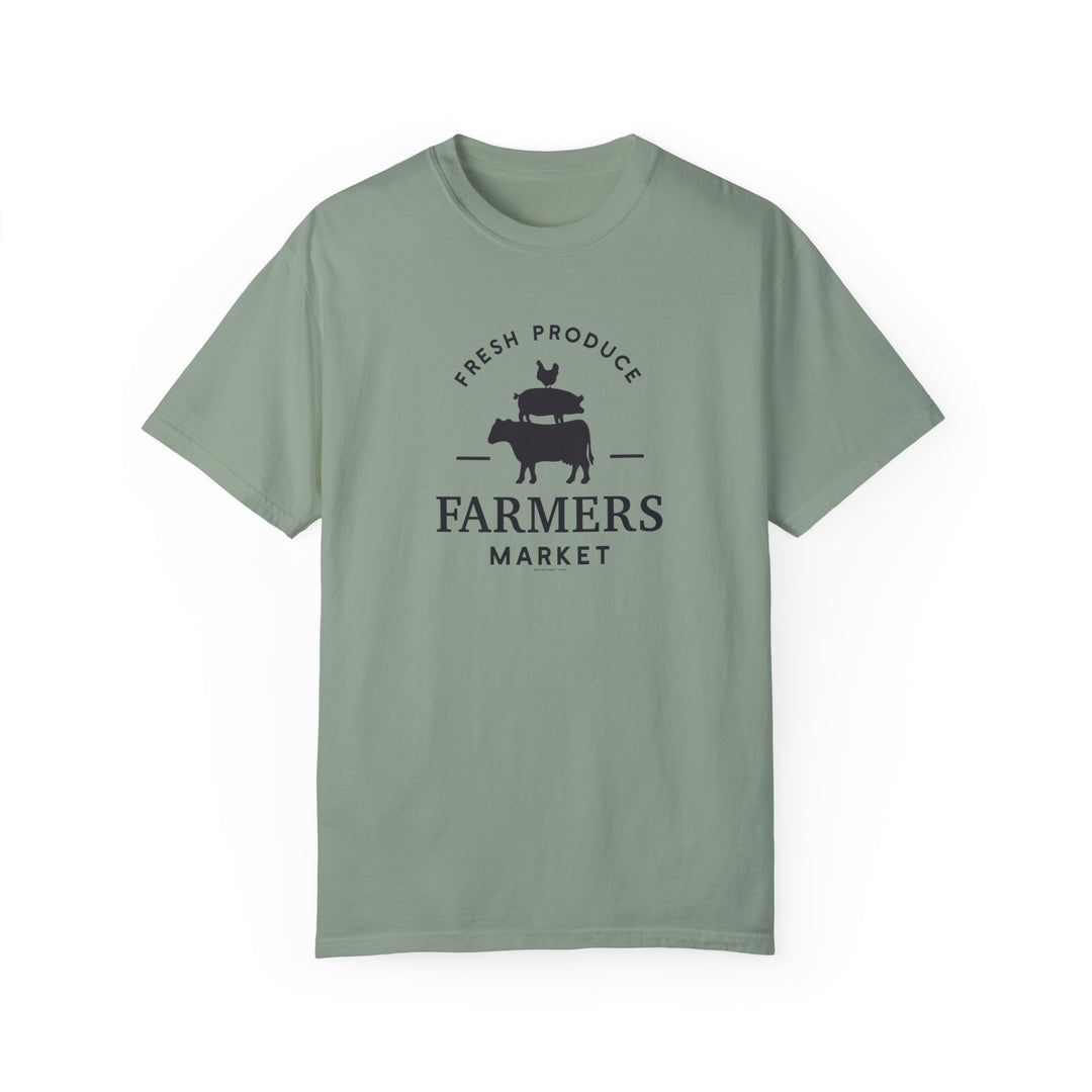 A green Farmers Market Tee, a relaxed fit t-shirt with a logo, crafted from 100% ring-spun cotton for durability and coziness. Ideal for daily wear with double-needle stitching and seamless design.