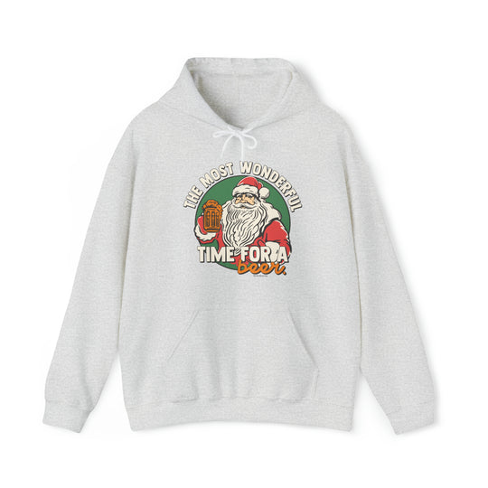 A white sweatshirt featuring Santa Claus holding a beer, perfect for the holiday season. Unisex heavy blend hooded sweatshirt made of 50% cotton and 50% polyester, with a kangaroo pocket and drawstring hood. Classic fit, tear-away label, and medium-heavy fabric.