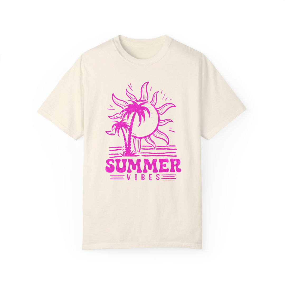 A relaxed fit Summer Vibes Tee, featuring a pink sun and palm trees graphic on a white shirt. Made of 100% ring-spun cotton for coziness, with double-needle stitching for durability. Dimensions: Width - 18.25 to 27.75, Length - 26.62 to 32.50, Sleeve length - 16.25 to 23.63.